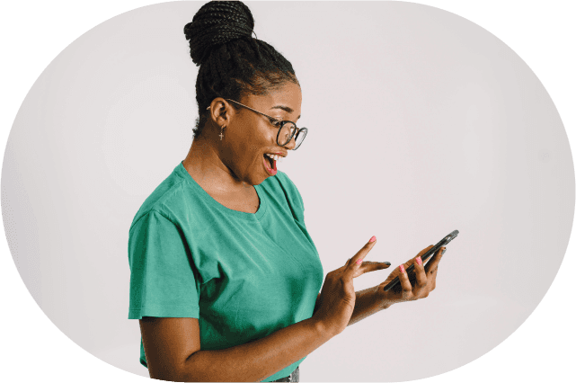 Woman looking at phone with excitement