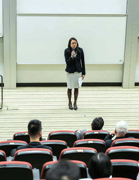 Woman speaking at a conference