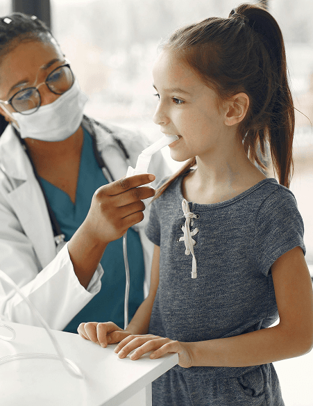 Healthcare professional examining a child