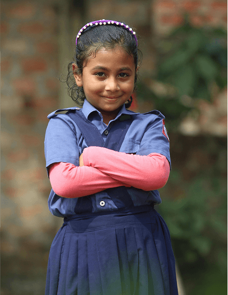 Young girl smiling with arms crossed